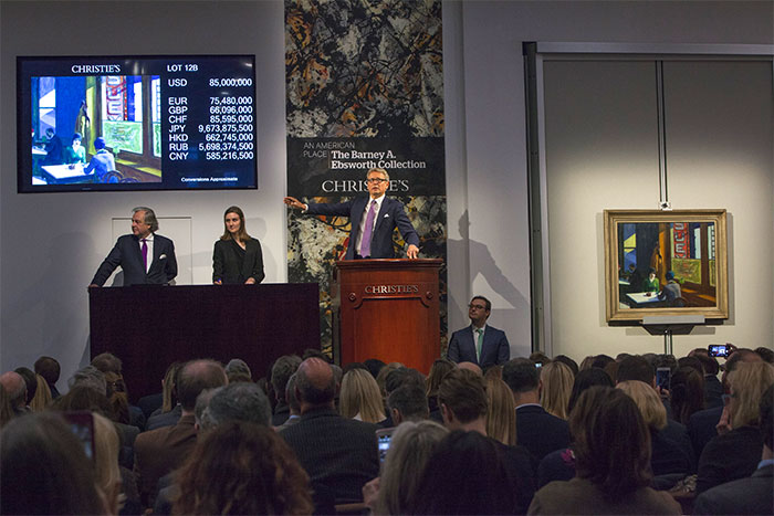 Jussi Pylkkänen, Christie’s Global President and Auctioneer, hammers down on the top lot of the sale, David Hockney’s Portrait of an Artist (Pool with Two Figures), painted in 1972, which sold for $90,312,500