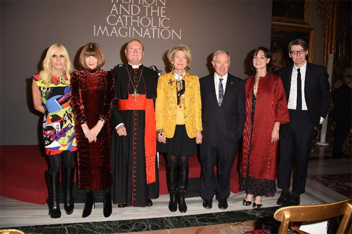 (From left) Donatella Versace, Anna Wintour, Cardinal Gianfranco Ravasi, Christine Schwarzman, Stephen A. Schwarzman, Carrie Rebora Barratt, and Andrew Bolton at The Met's Heavenly Bodies: Fashion and the Catholic Imagination advance press event. Courtesy of The Metropolitan Museum of Art/@spgitalia