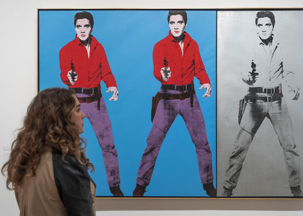 Installation view of Andy Warhol at Tate Modern featuring Andy Warhol's Elvis I and II 1963; 1964